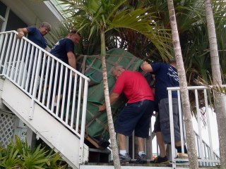 Frank and Sons Moving a piano down three floors